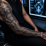 Realistic cybersigilism tattoo sleeve with futuristic blackwork patterns and cyberpunk inspired tattoo details